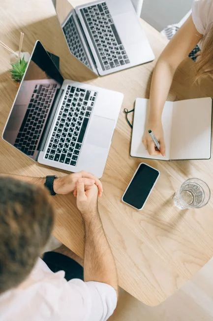 Close-up view of a vintage camera beside a social media marketing concept caption on a brown backdrop.